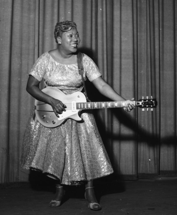 American gospel singer and guitarist Sister Rosetta Tharpe (1915 - 1973) performing on stage with Chris Barber's Jazz Band, Cardiff, Wales, November 1957. (Photo by Chris Ware/Keystone Features/Hulton Archive/Getty Images)
